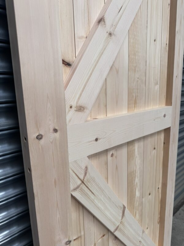 Close up of framing and bracing of wooden garage side door