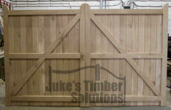 Overview of the rear of oak driveway gates, showing framed ledged and braced, morticed and tenoned detailing.