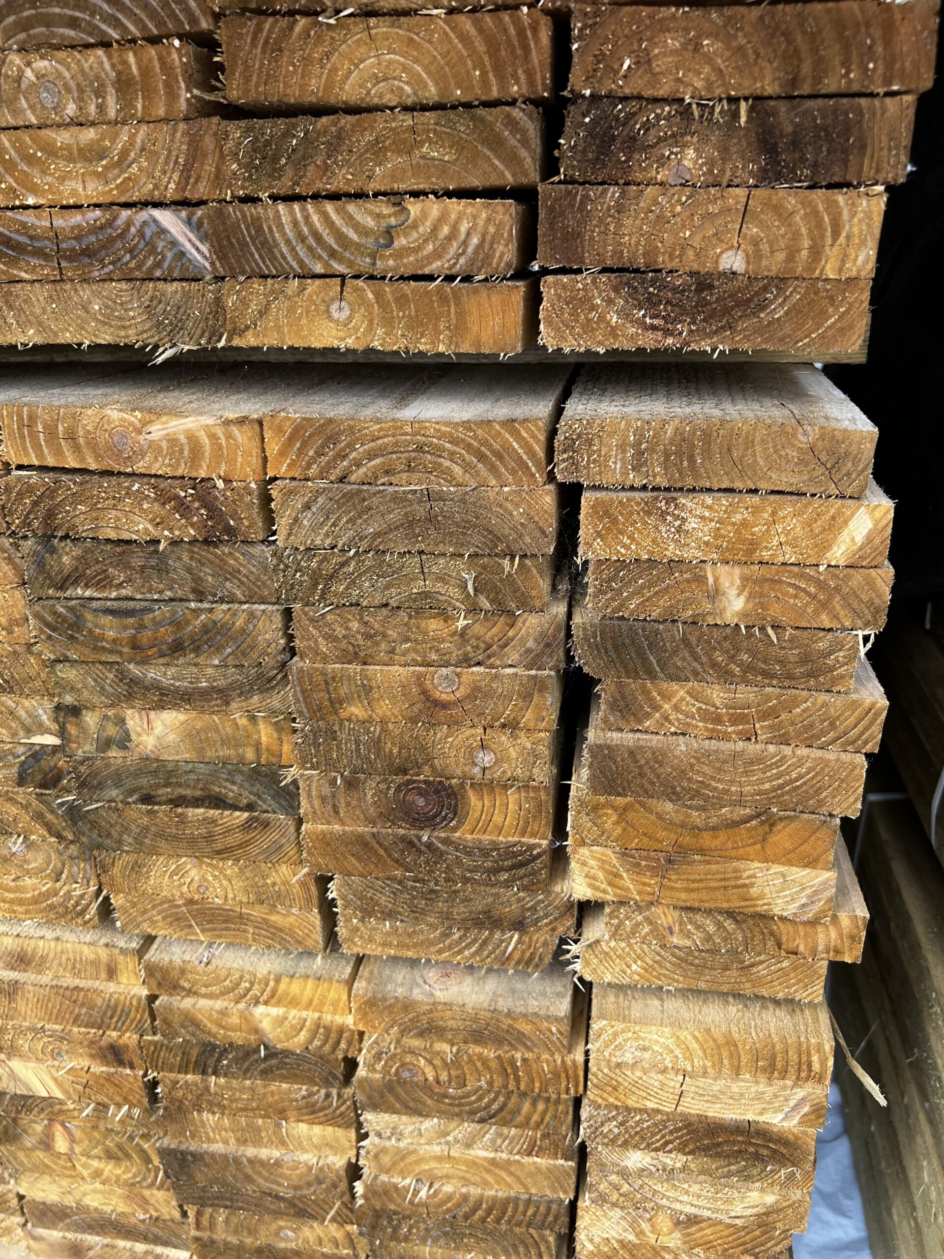 Stacked tanalised rough sawn timber