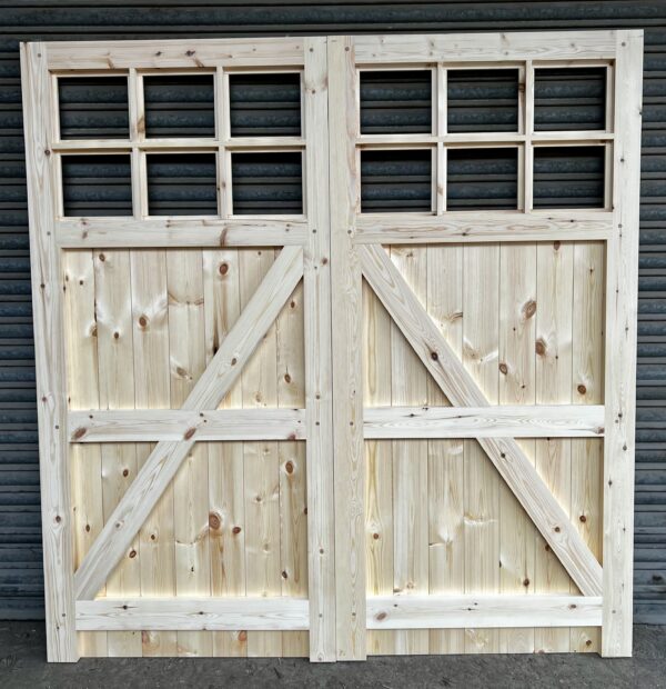 Rear of wooden garage doors showing details of framing, ledging and bracing