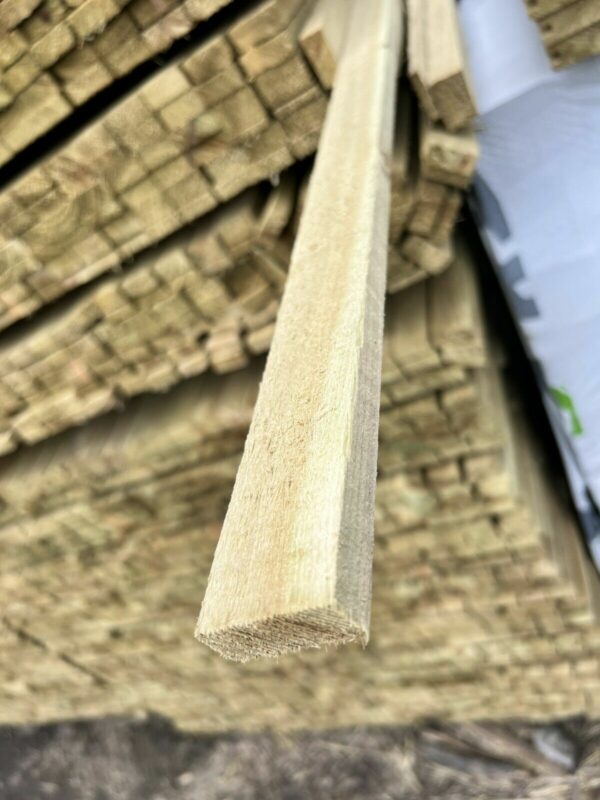 Length of tanalised timber, pulled out from stack in timber yard