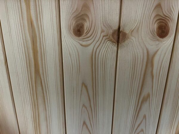 Close up of detailing in wooden tongue and groove cladding