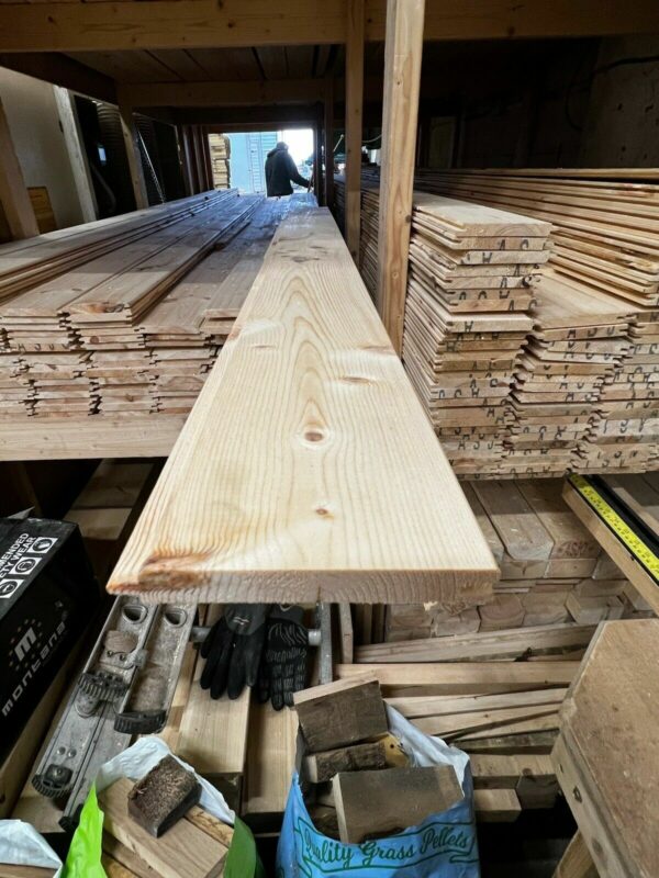 A length of tongue and groove 15mm match board cladding pulled out from stack in wood yard.