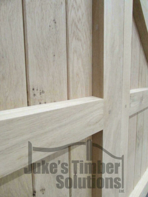 Close up of structural detailing on oak bow top driveway gates
