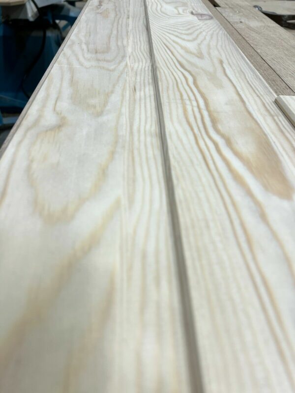 Close up of patterning on wooden tongue and groove cladding