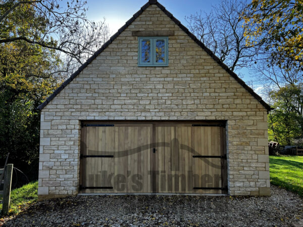 Iroko garage door fitted into a stone garage