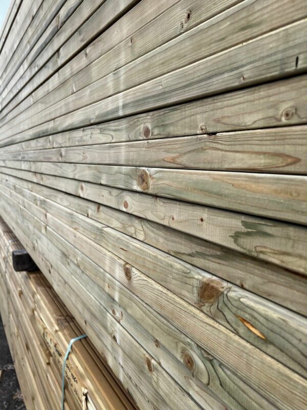 Stacked lengths of tanalised CLS timber