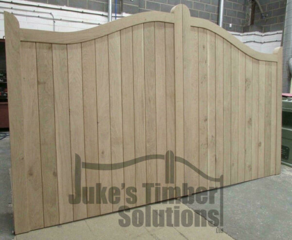 Wooden oak swan neck driveway gate in Juke's Timber Solutions workshop