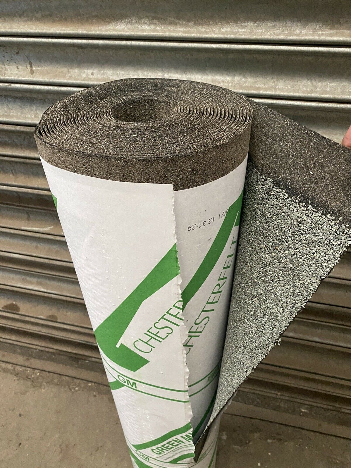 Roll of Green Mineral Felt 10m x 1m, roll opened showing the texture of the felt