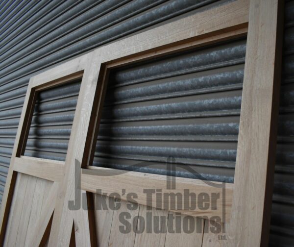 Close up of Oak Single Pane Framed, Ledged and Braced Garage Doors