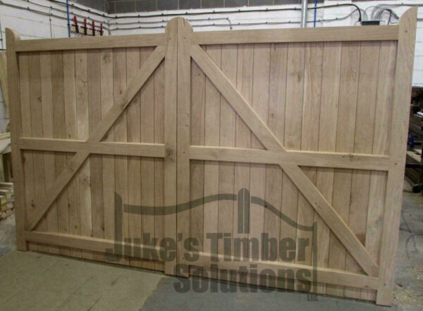 Overview of the back of oak driveway gates showing the framed, ledged and braced detailing. Pictured in Juke's Timber Solutions workshop.
