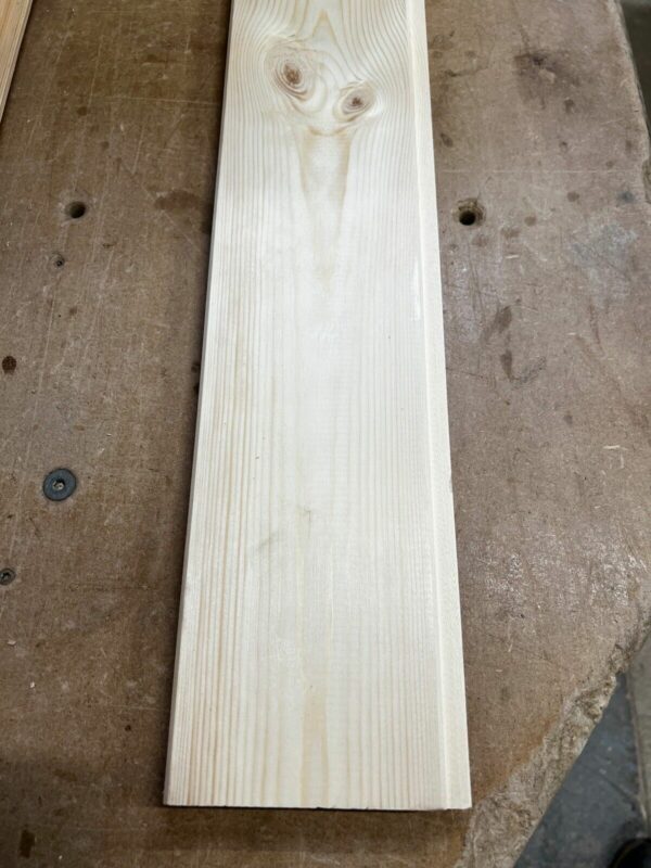 Single length of wooden tongue and groove 21mm match board cladding