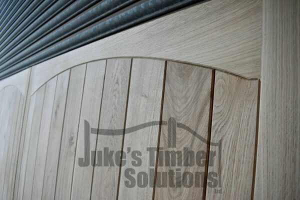 Close Up of Hardwood Garage Doors with Curved Detailing