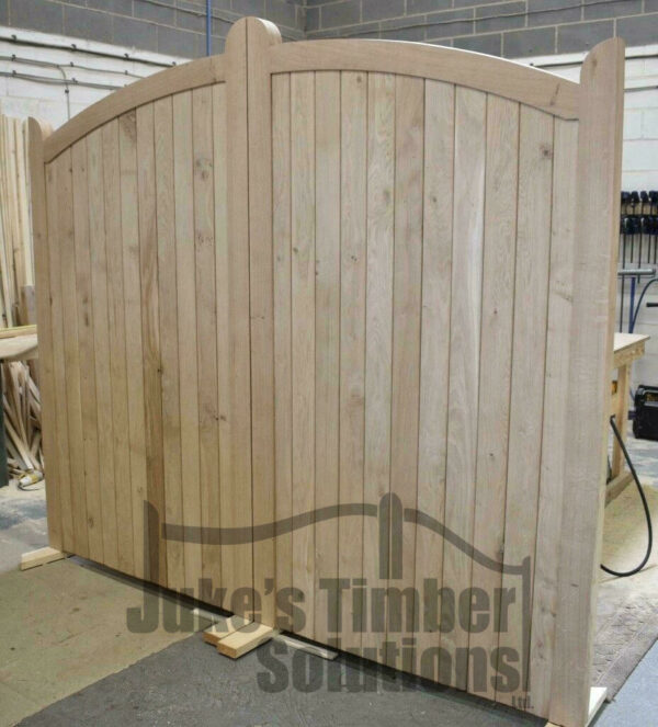 Wooden oak bow top driveway gate pictured in the Juke's Timber Solutions workshop