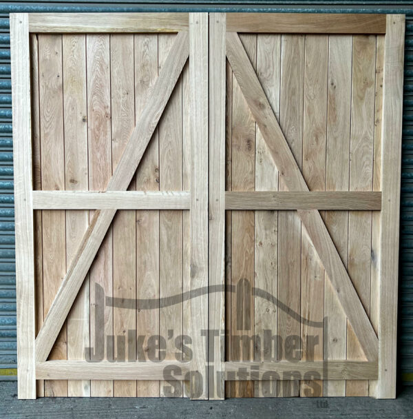 Rear detailing of a set of full board oak garage doors