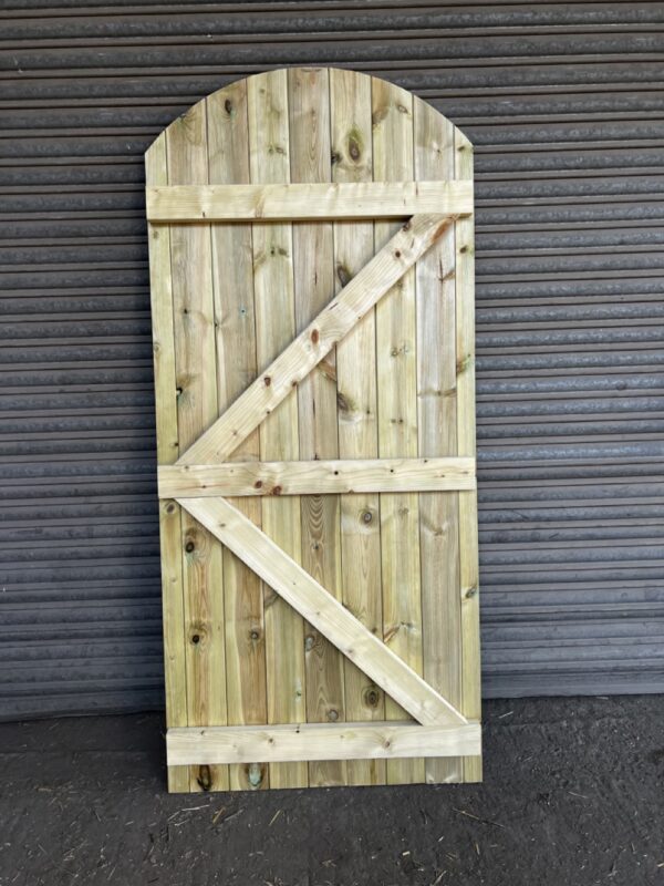 Rear of a tanalised matchboard curved top garden gate