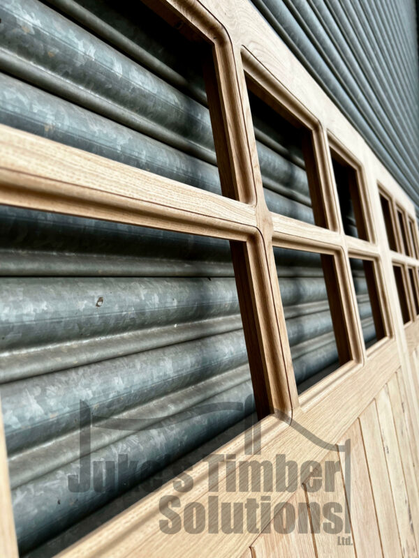 Close up of the panes in an oak super heavy duty 12 pane garage door