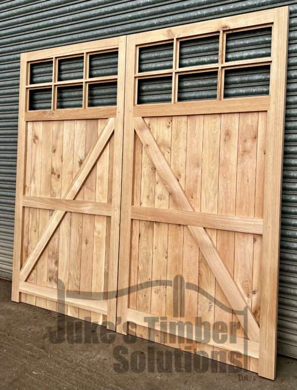 Rear of an oak super heavy duty 12 pane garage door, showing framing and ledging