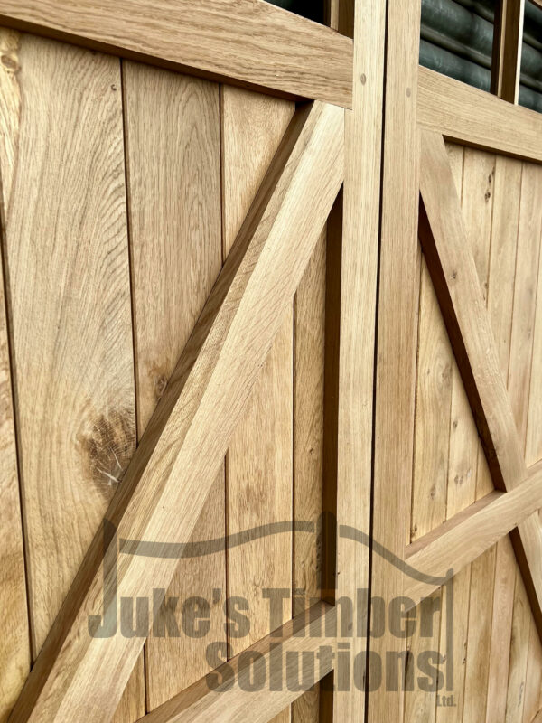 Close up of detailing on oak 12 pane, framed, ledged and braced garage door