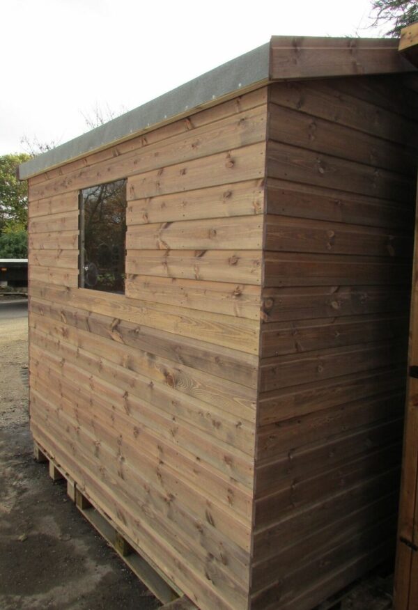 Side on view of an apex shiplap garden shed with a window.