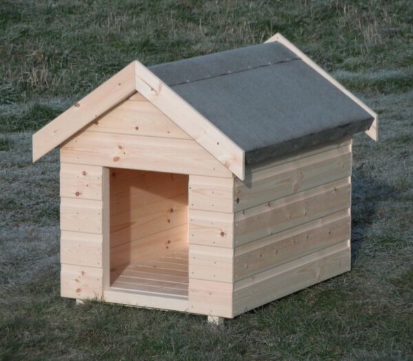 Warm wooden dog kennel pictured outside in garden on grass