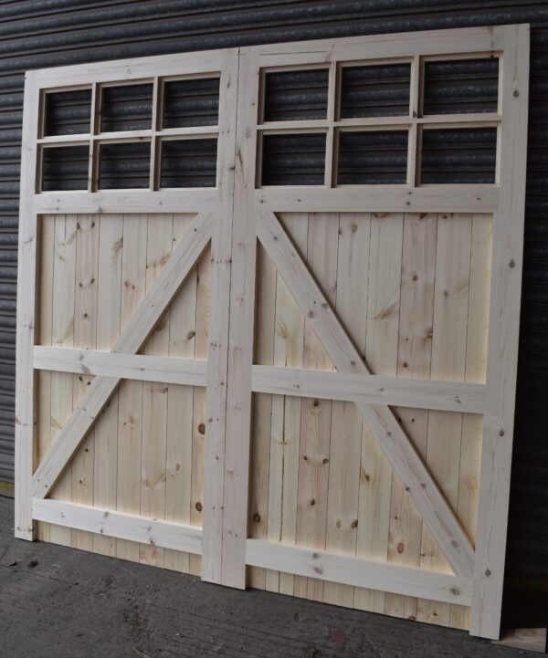 Rear of a 12 pane garage door with framing, ledging and bracing