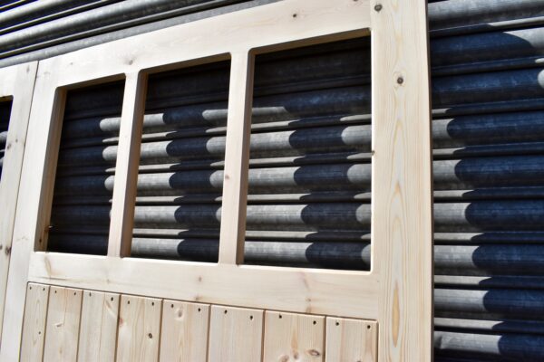 Close up of 3 panes on a 6 pane wooden garage door
