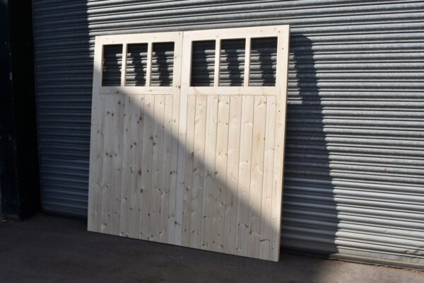 Front of a 6 pane wooden garage door
