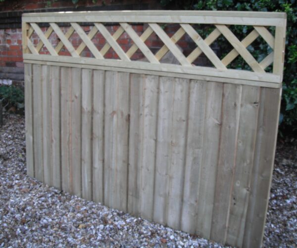 Length of heavy duty wooden fencing and trellis pictured in garden