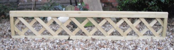 Length of heavy duty wooden trellis pictured in gravel