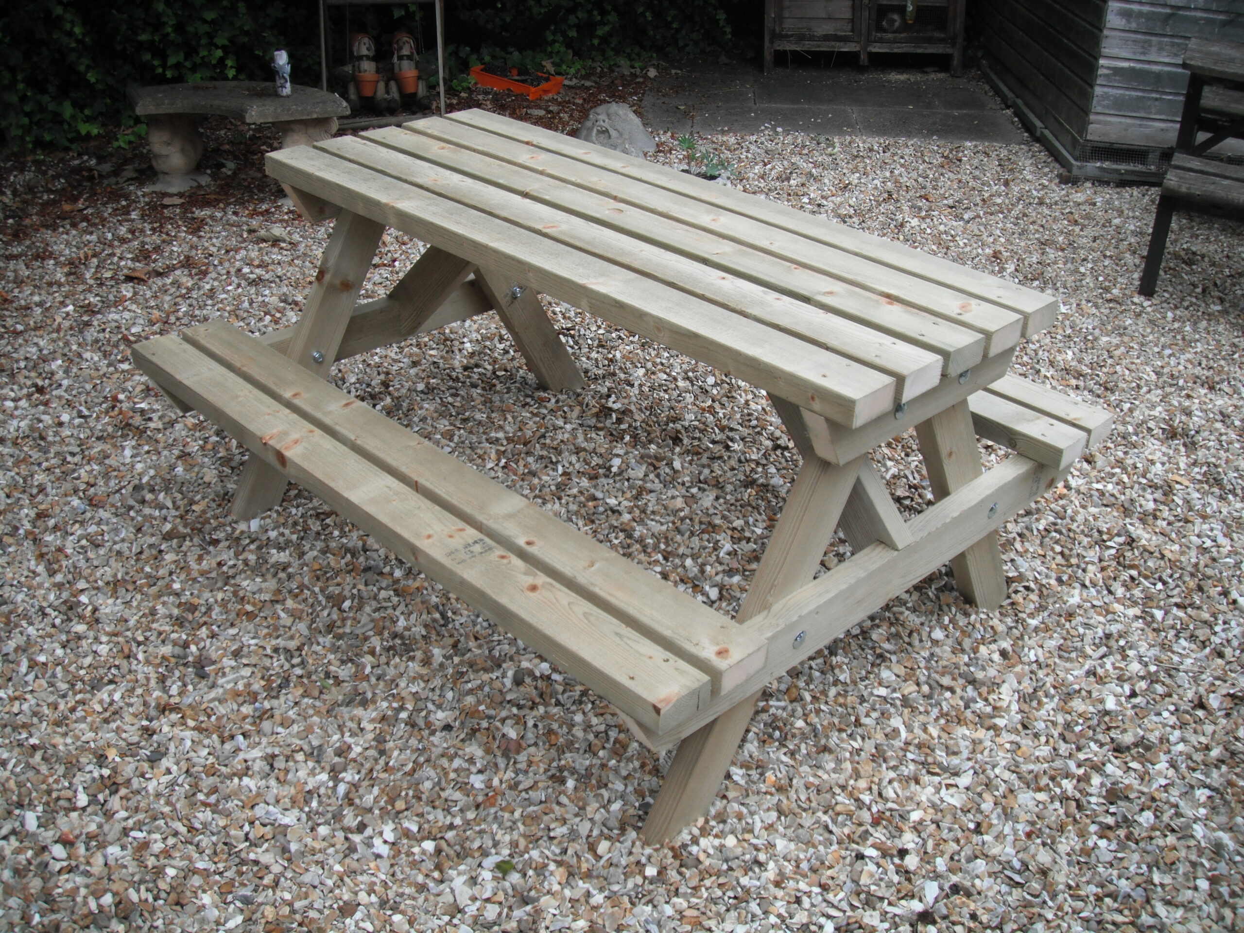 Tanalised picnic table bench in garden on gravel