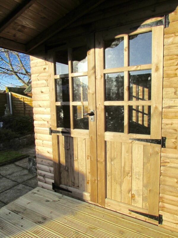 Front doors of a summerhouse log cabin