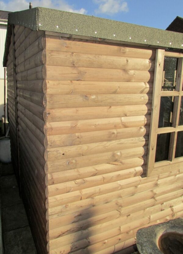 Close up of the side of a summer house log cabin
