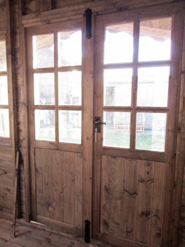 Interior of the doors of a 10ft x 10ft wooden summer house log cabin