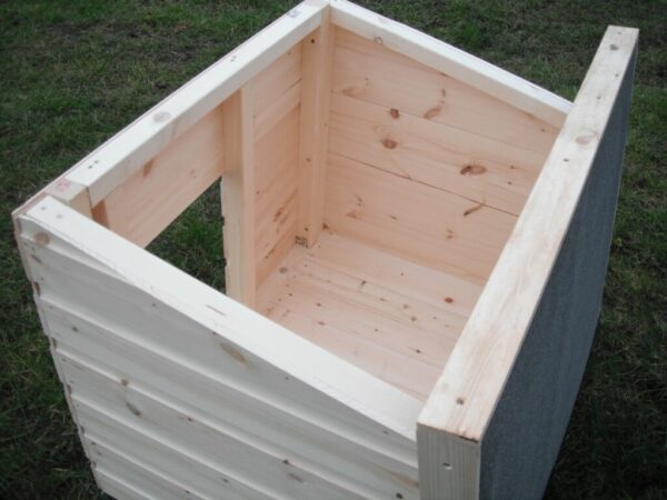 Open top of a wooden dog kennel