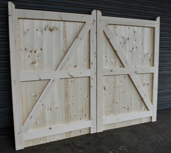 Rear of a wooden driveway gate, showing framing, ledging and bracing