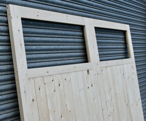 Close up of single pane wooden heavy duty garage doors
