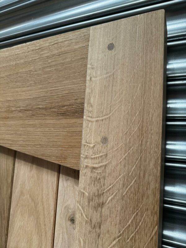 Close up of detailing on oak angled garage doors